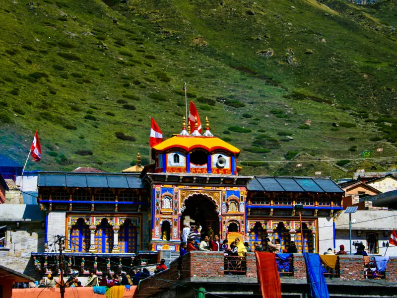  a view of badrinath temple near Bansi Narayan Temple mountain in the background